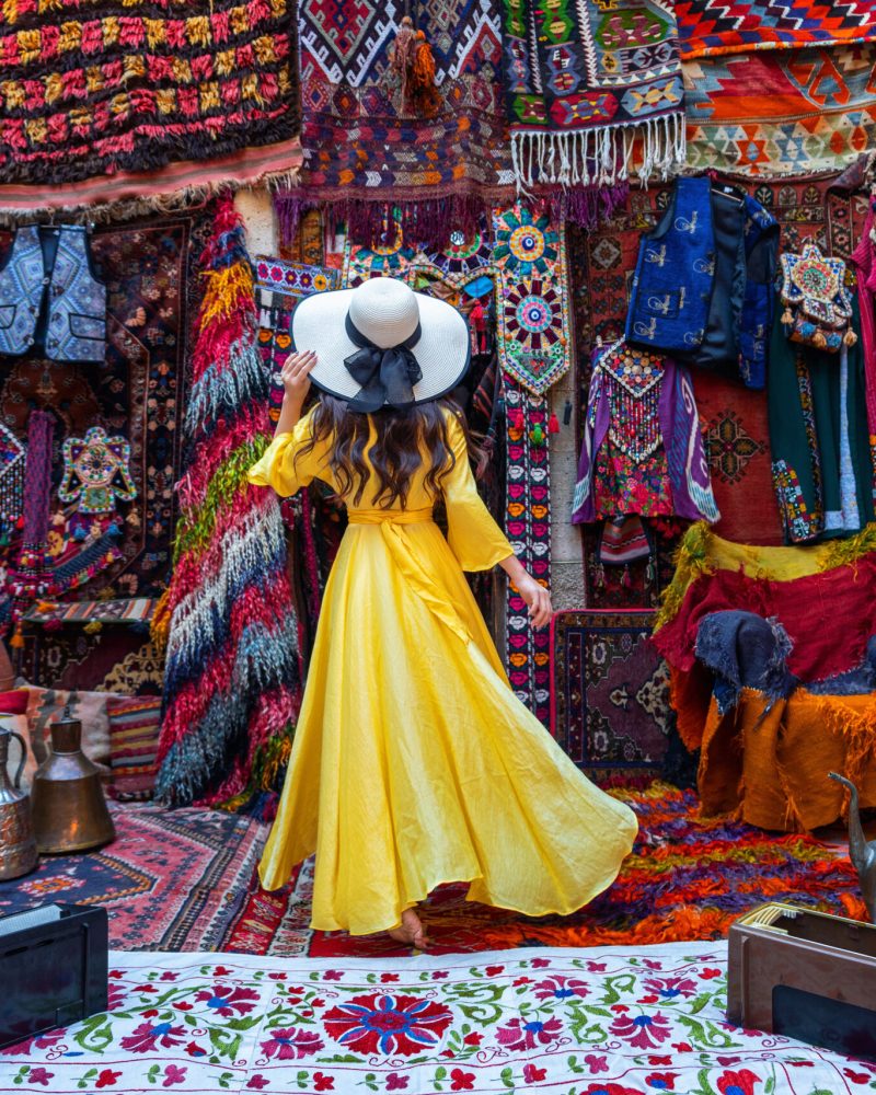 Beautiful girl at traditional carpet shop in Goreme city, Cappadocia in Turkey.
